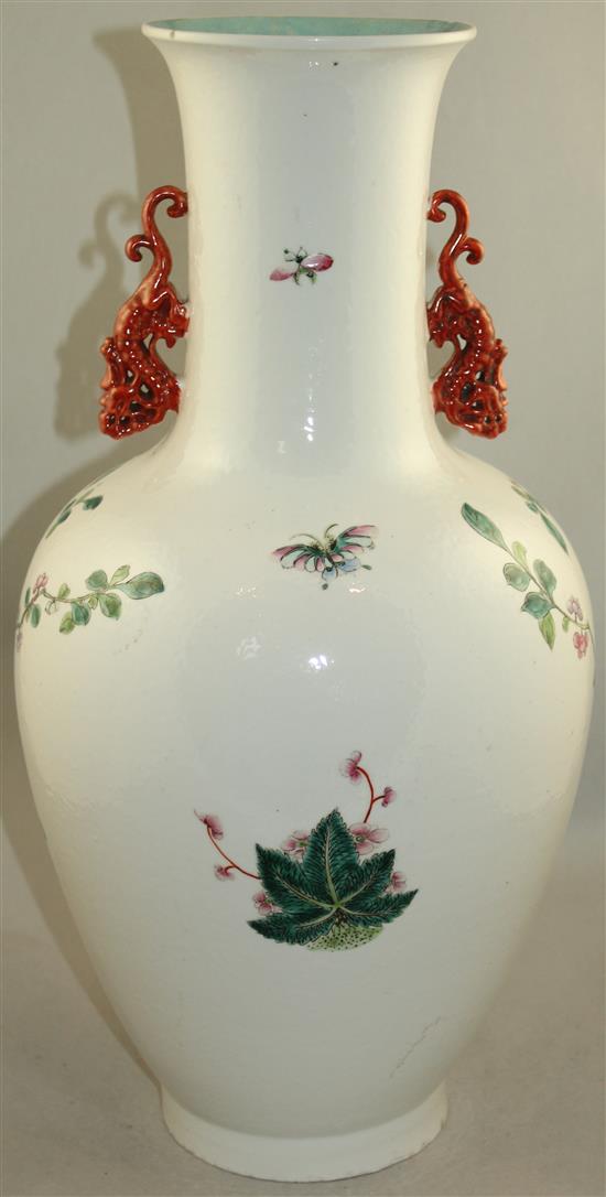 A large Chinese famille rose twin handled bottle vase, Qianlong seal mark, late 19th century, 54cm., foot ground off in manufacture